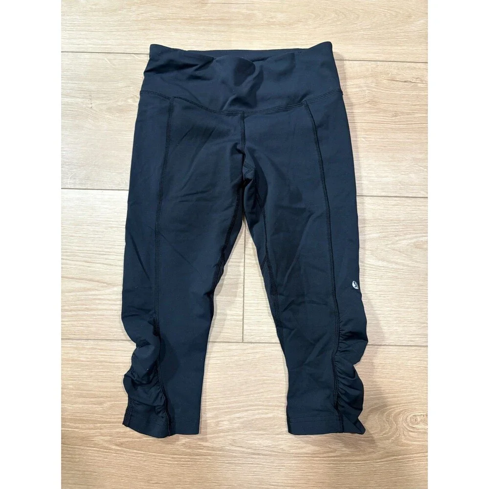 Lululemon Black Run Inspire Crop Leggings Ruched Mesh Size 4 Zipper Pocket Yoga